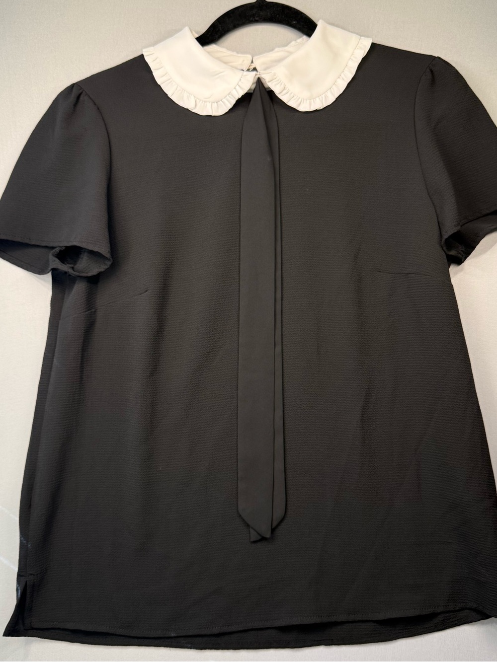 CeCe Black Short-Sleeve Blouse with White Ruffle Peter Pan Collar and Neck Tie - Picture 2 of 12